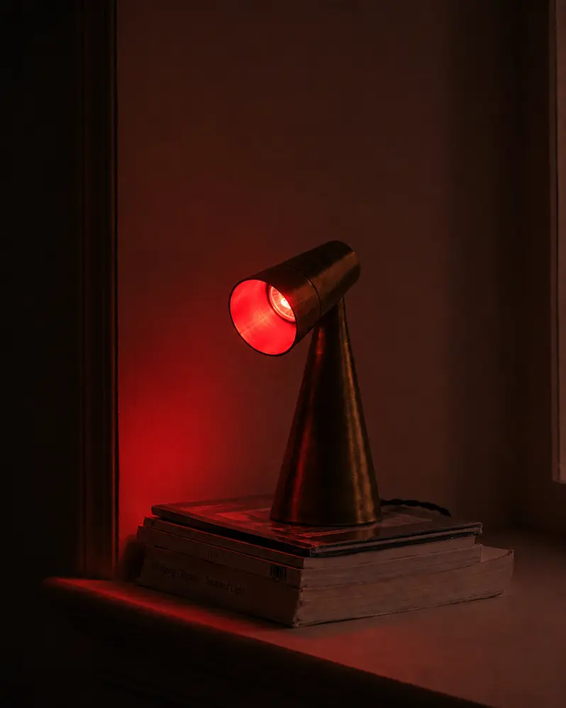 Milieu lamp lit red at night in the evening